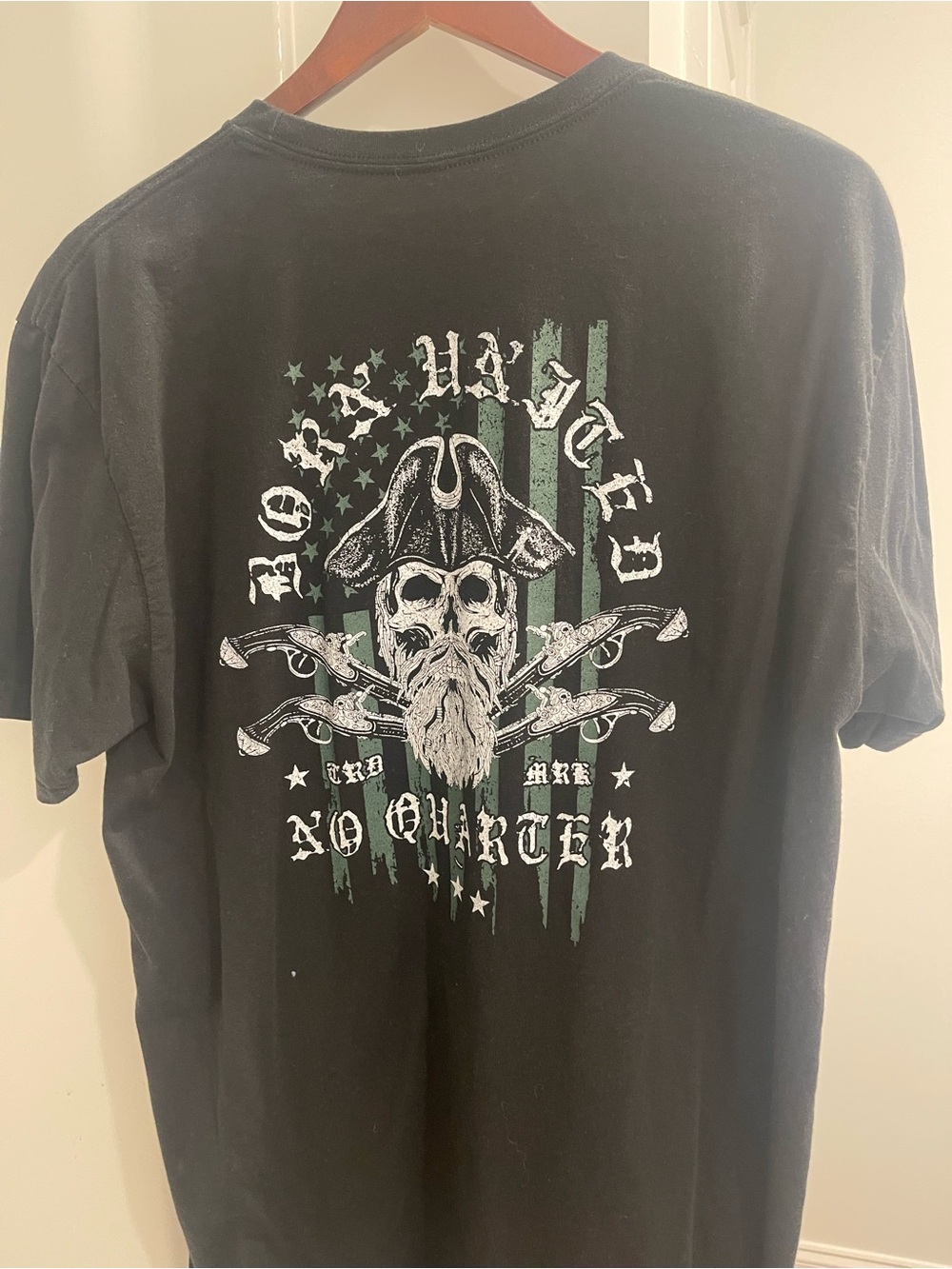 Men's Black Graphic Pirate Skull Tee with Faded Green Flag Accents